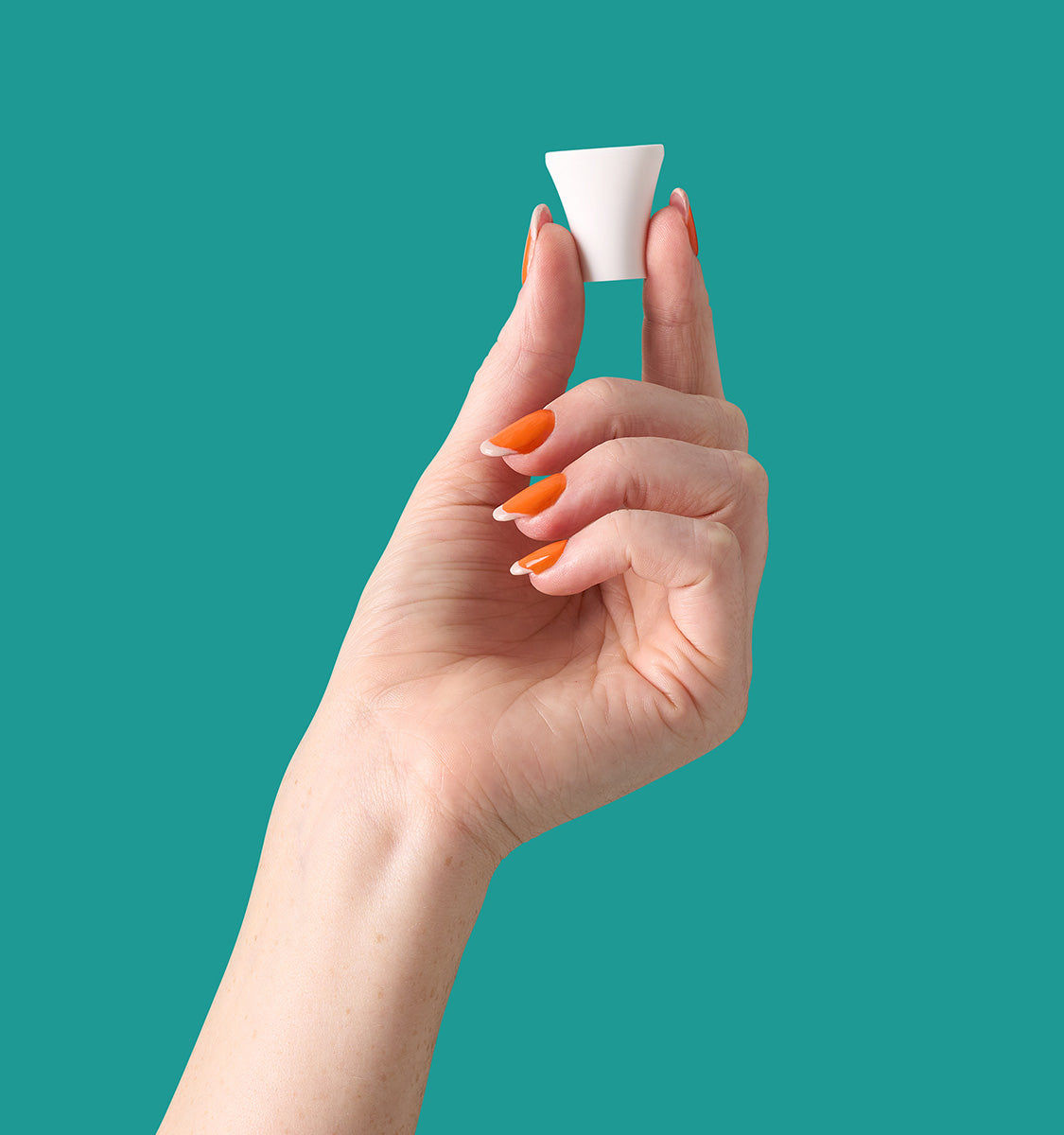 hand holding Auria Microdermabrasion Kinetic Toning Tip