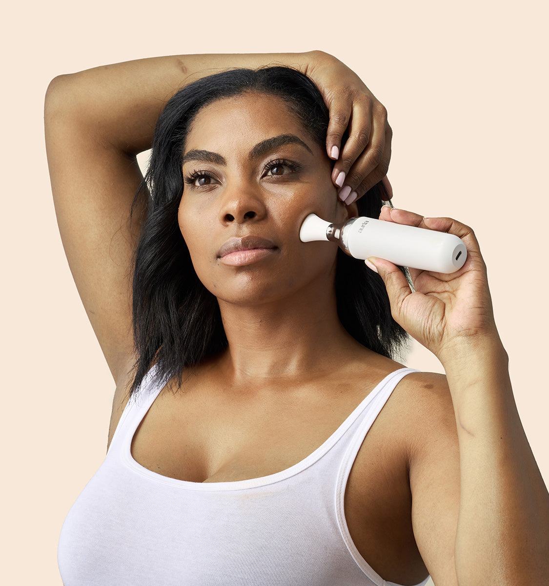 woman using Auria Microdermabrasion Kinetic Toning Tip
