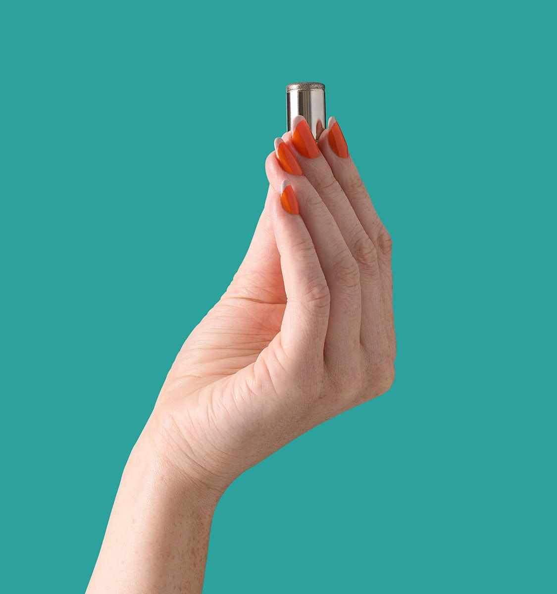 Hand holding Auria Microdermabrasion Fine Diamond Tip