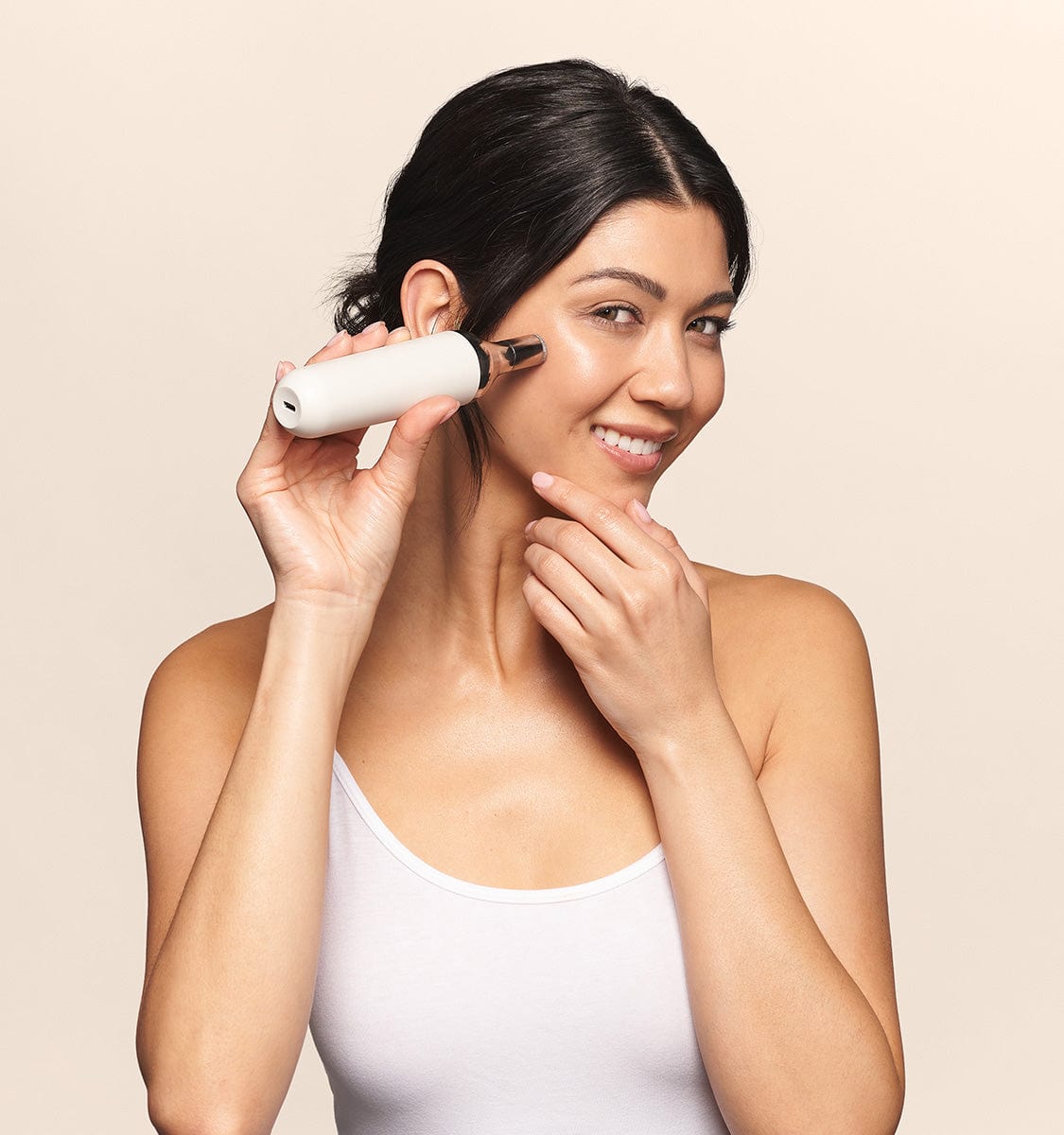 woman using Auria Microdermabrasion Fine Diamond Tip